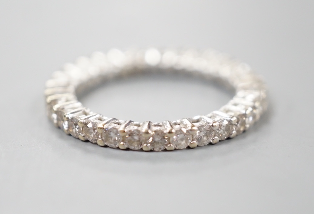 A modern 18ct white gold and diamond set full eternity ring, size M, gross weight 3.4 grams.
